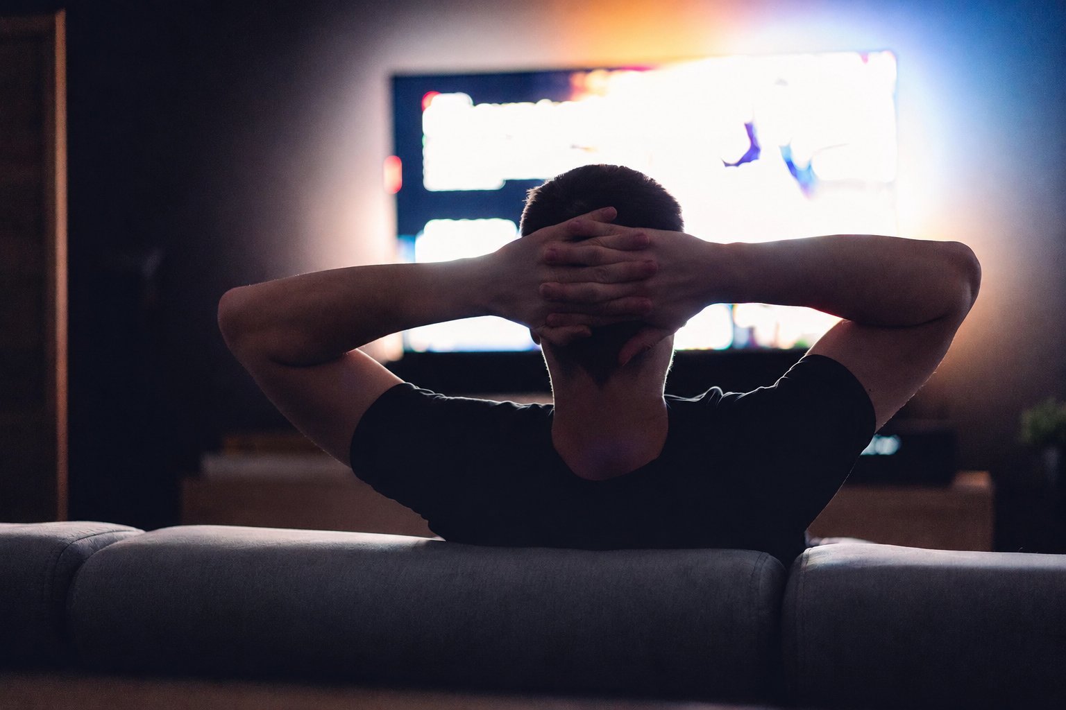 Person scrolling endlessly, looking for something to watch